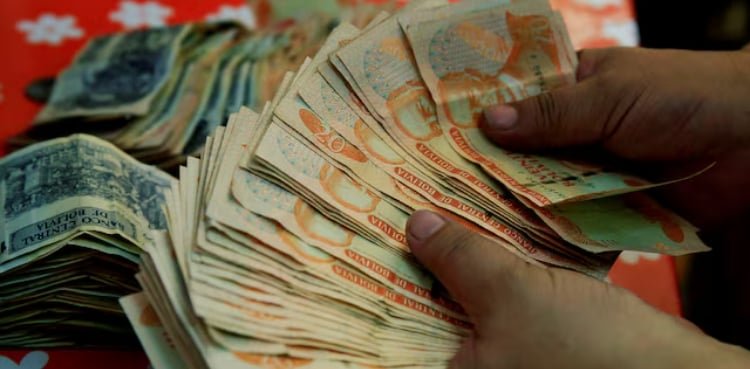 Bolivia ends 15-year dollar peg